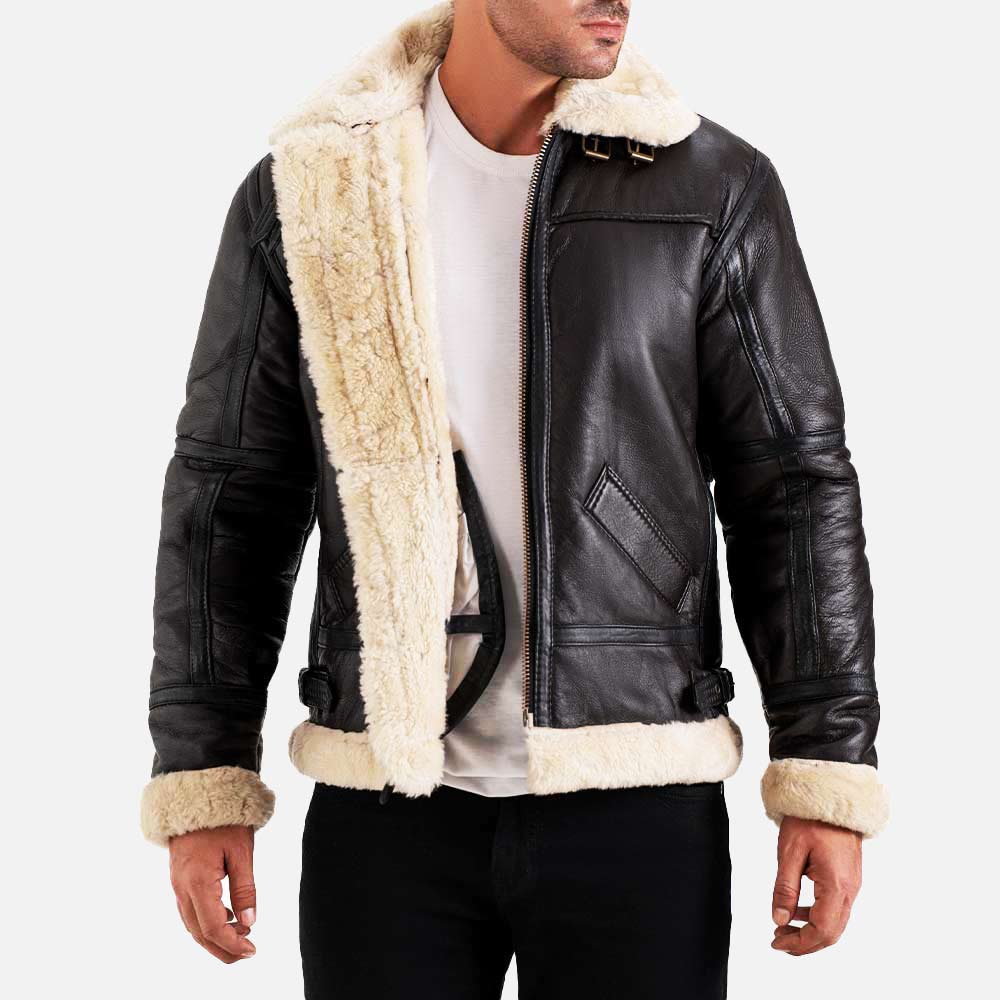 Man wearing a black leather jacket with beige fur lining on a white background